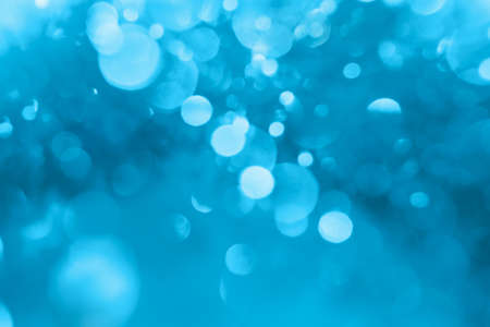 Abstract blue color bokeh. Christmas background textureの写真素材