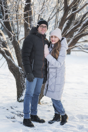 Young couple in love at winter parkの写真素材