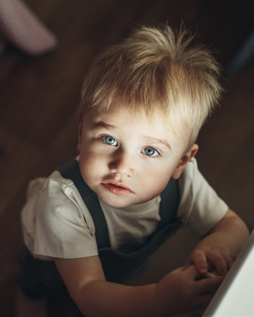 Baby boy at home. Top view Soft focusの写真素材