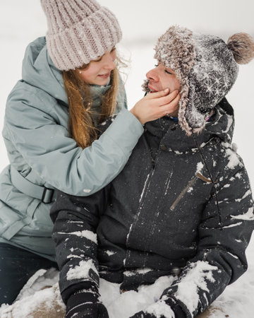 Portrait of smiling couple in love. Young happy couple walking in winter dayの写真素材