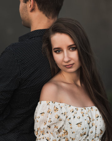 Close up sensual portrait of young couple in love outsideの写真素材