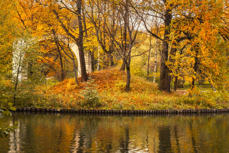 View of Island Arch and pond in Tsaritsyno park on autumn day. Moscow. Russiaの写真素材