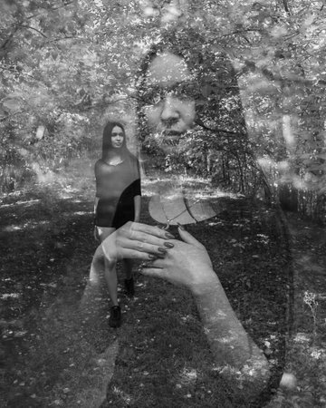 Emotional woman portrait outdoors. Creative. Double exposure. Black and white.の写真素材