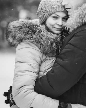 Portrait of young couple in winter forest. Black and whiteの写真素材