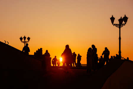 Silhouette of a group of people against the sunset on embankment of Sevastopol. Crimeaの写真素材