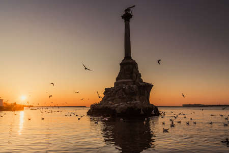 View of monument to sunken ships in Black sea water at sunset. Sevastopol, Crimeaの写真素材
