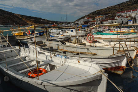 Sevastopol, Crimea - March 15, 2021: Parking boats and yachts at Balaklava bay in springのeditorial素材