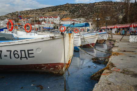 Sevastopol, Crimea - March 15, 2021: Parking boats and yachts at Balaklava bay in springのeditorial素材