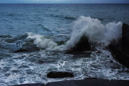 Storm at Black sea in spring. Sea view with waves during rain and cloudy in Alupka. Crimeaの写真素材
