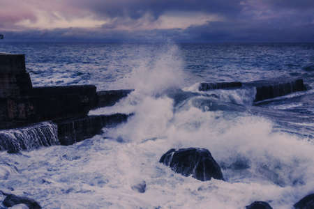 Black Sea in rainy stormy weather in spring at sunset. Alupka, Crimeaの写真素材