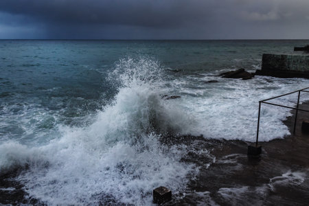 Storm at Black sea in spring. Sea view with waves during rain and cloudy in Alupka. Crimeaの写真素材