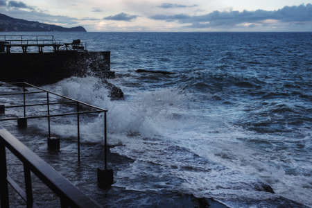 Storm at Black sea in spring. Sea view with waves during rain and cloudy in Alupka. Crimeaの写真素材