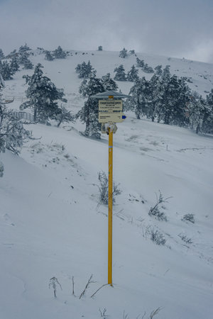 Yalta, Crimea - March 20, 2021: Sign on top of mountain Ai-Petri after blizzard in spring. Crimeaのeditorial素材