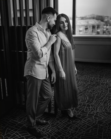 European young couple at hotel room. black and whiteの写真素材