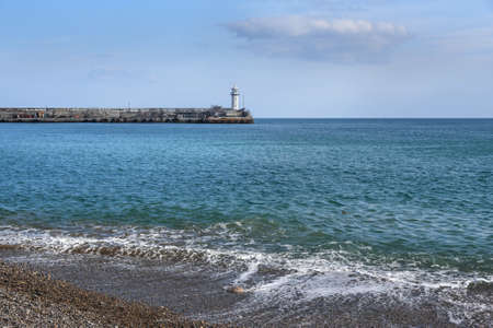View of old Yalta lighthouse from embankment. Yalta, Crimeaの写真素材
