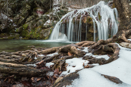 Diferent cascades of Djur-Djur waterfall on Ulu-Uzen river in early spring with snow. Khapkhalskiy canyon in Crimeaの写真素材