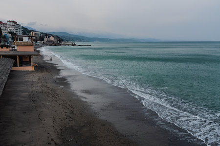 Deserted beach of Black sea in cloudy weather at early spring. Alushta. Crimeaの写真素材