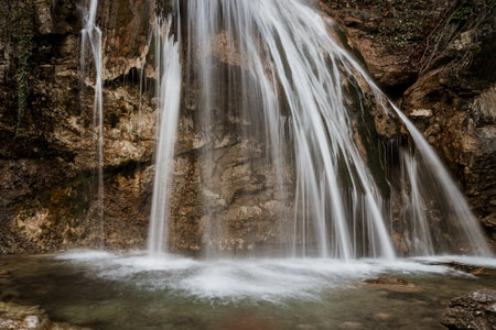 Djur-Djur waterfall in early spring with snow. Khapkhalskiy canyon in Crimeaの写真素材
