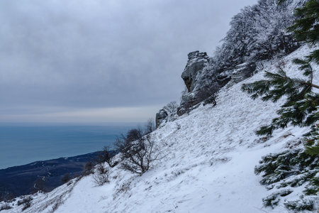 View from Mount Alenga slope, Southern Demerdzhi in snow and ice in early spring. Crimeaの写真素材