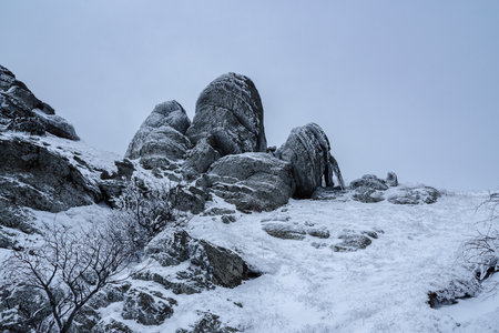 Rocks on Mount Alenga near Southern Demerdzhi in snow and ice in early spring. Crimeaの写真素材