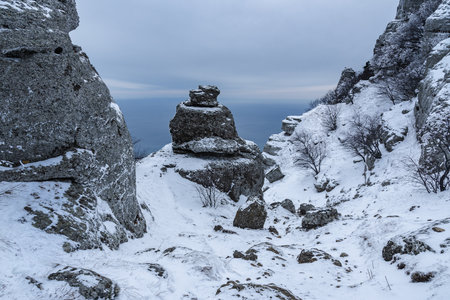 Rocks on Mount Alenga near Southern Demerdzhi in snow and ice in early spring. Crimeaの写真素材
