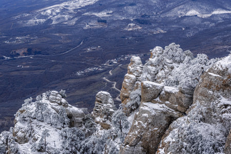 Rocks on Southern Demerdzhi mountain in snow after blizzard in early spring. Crimeaの写真素材