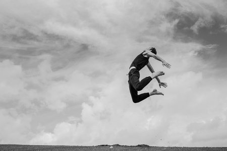 Man jumping in the air. black and whiteの写真素材