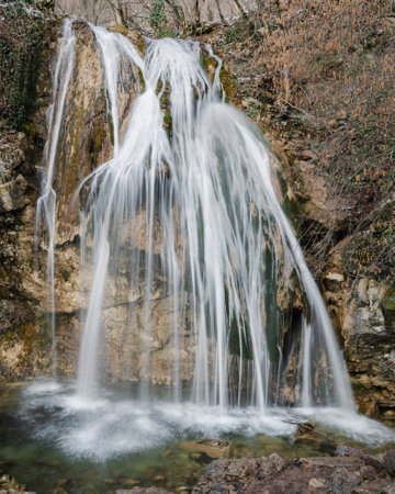 Djur-Djur waterfall in early spring with snow. Khapkhalskiy canyon in Crimeaの写真素材