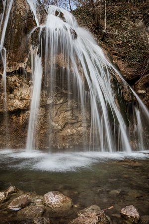 Djur-Djur waterfall in early spring with snow. Khapkhalskiy canyon in Crimeaの写真素材