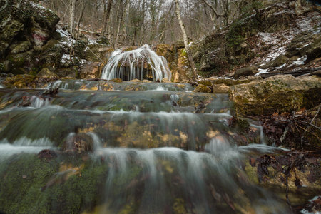 Cascades of Djur-Djur waterfall on Ulu-Uzen river in early spring with snow. Khapkhalskiy canyon in Crimeaの写真素材