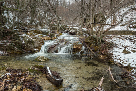 Diferent cascades of Djur-Djur waterfall on Ulu-Uzen river in early spring with snow. Khapkhalskiy canyon in Crimeaの写真素材
