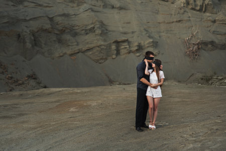 Romantic couple blindfolded with black ribbon outdoors. love blind conceptの写真素材