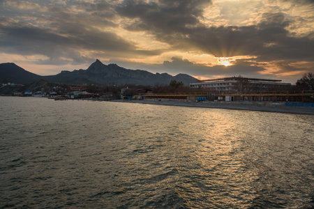 View of the empty beaches and embankment of resort village of Koktebel in spring. Crimeaの写真素材