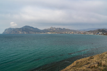 View of seaside resort city Koktebel , mountain Kara Dag from hills in spring. Crimeaの写真素材