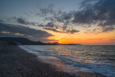 Colorful sunrise at sea. Beach of Koktebel. Crimeaの写真素材