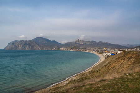 View of seaside resort city Koktebel , mountain Kara Dag from hills in spring. Crimeaの写真素材