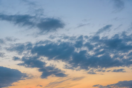 Sunrise sky with beautiful light blue clouds. background textureの写真素材