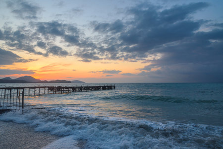 Wooden pier in the sea at sunrise in spring. Koktebel. Crimeaの写真素材