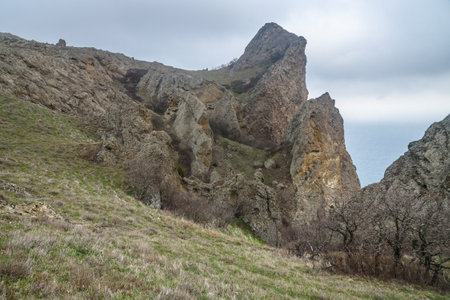 Landscape of Karadag Reserve in spring. View of rocks of ridge Karagach on cloudy day. Crimeaの写真素材