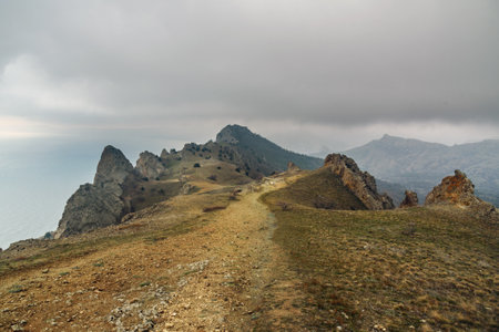 Landscape of Karadag Reserve in spring. View of rocks of ridge Karagach on cloudy day. Crimeaの写真素材