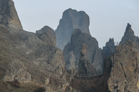 Rocks in Dead city in fog and clouds. Khoba-Tele Ridge of Karadag Reserve in early spring. Crimeaの写真素材