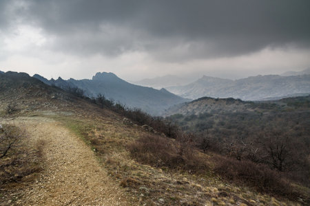 Landscape of Karadag Reserve in early spring. View of mountains in fog and clouds. Crimeaの写真素材