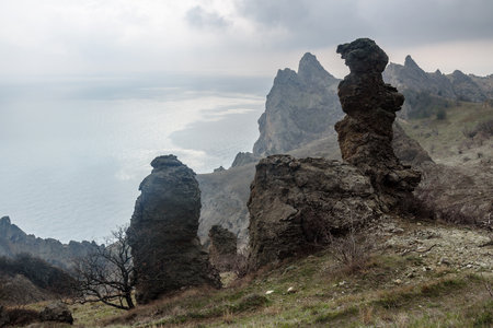Gingerbread horse rock and bizarre rocks in Dead city. Khoba-Tele Ridge of Karadag Reserve in early spring. Crimeaの写真素材