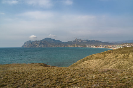 View of seaside resort city Koktebel , mountain Kara Dag from hills in spring. Crimeaの写真素材