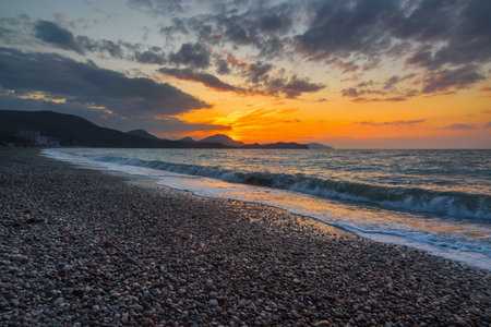 Colorful sunrise at sea. Beach of Koktebel. Crimeaの写真素材
