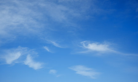 Blue sky background with white clouds, textureの写真素材