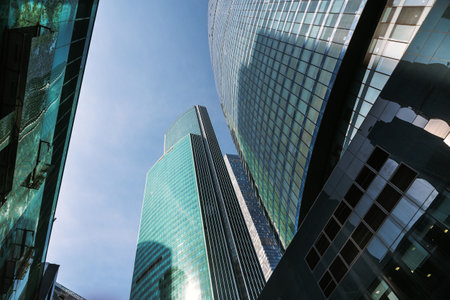 Upward view of modern skyscrapers in business center of Moscow City on blue background. Moscow. Russiaの写真素材