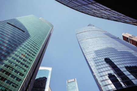 Upward view of modern skyscrapers in business center of Moscow City on blue background. Moscow. Russiaの写真素材