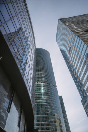 Upward view of modern skyscrapers in business center of Moscow City on blue background. Moscow. Russiaの写真素材