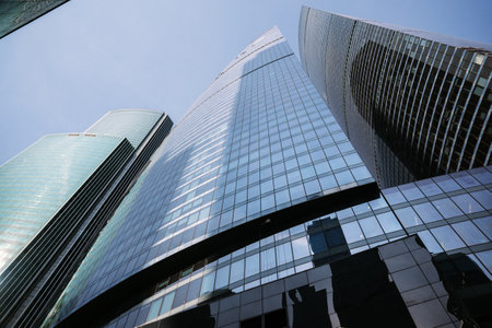 Upward view of modern skyscrapers in business center of Moscow City on blue background. Moscow. Russiaの写真素材